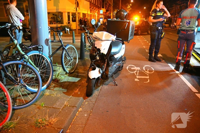 Maaltijdbezorger gewond bij botsing met concurrent