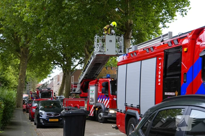 Persoon ademt rook in bij keukenbrand