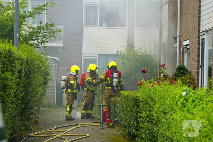 Uitslaande woningbrand door wasmachine
