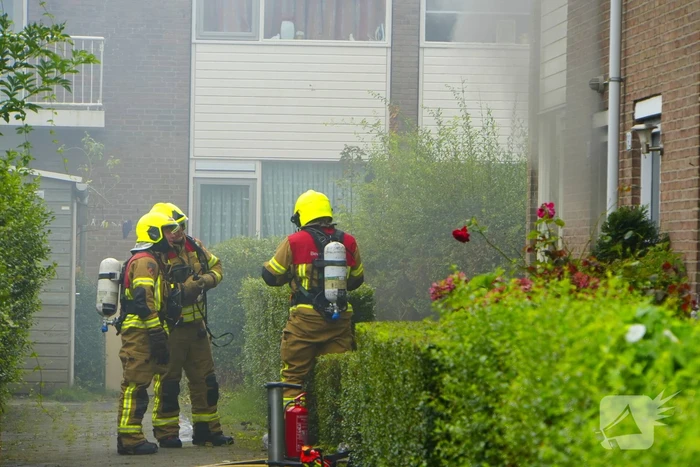 Uitslaande woningbrand door wasmachine