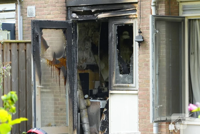 Uitslaande woningbrand door wasmachine