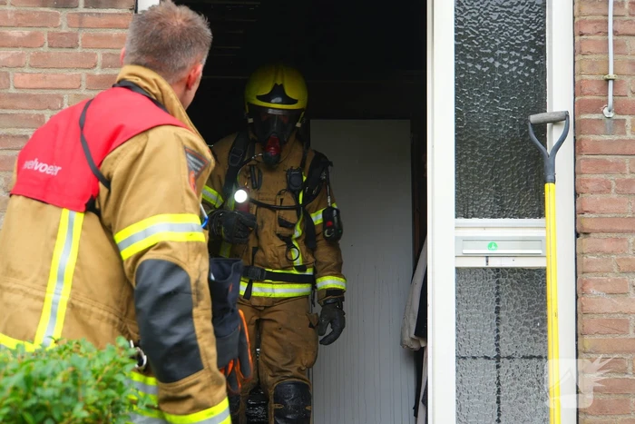 Uitslaande woningbrand door wasmachine