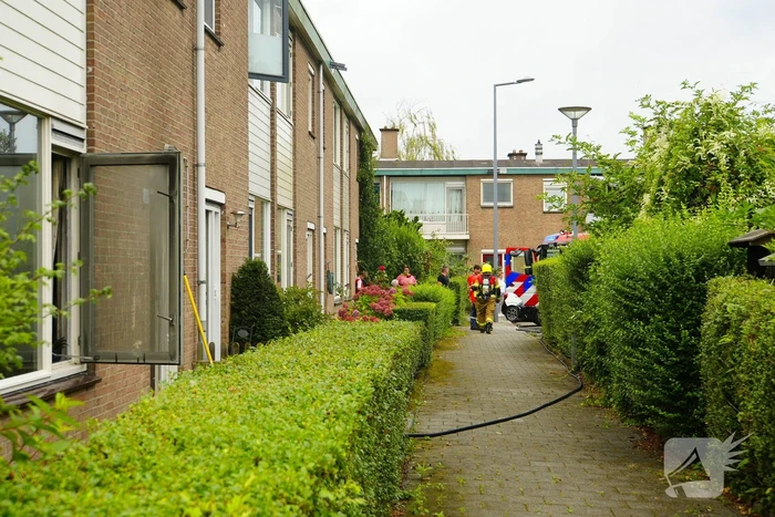 Uitslaande woningbrand door wasmachine