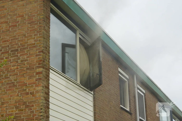Uitslaande woningbrand door wasmachine