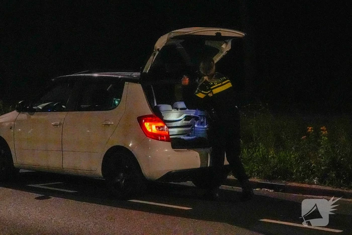 Persoon overvallen die in auto zat