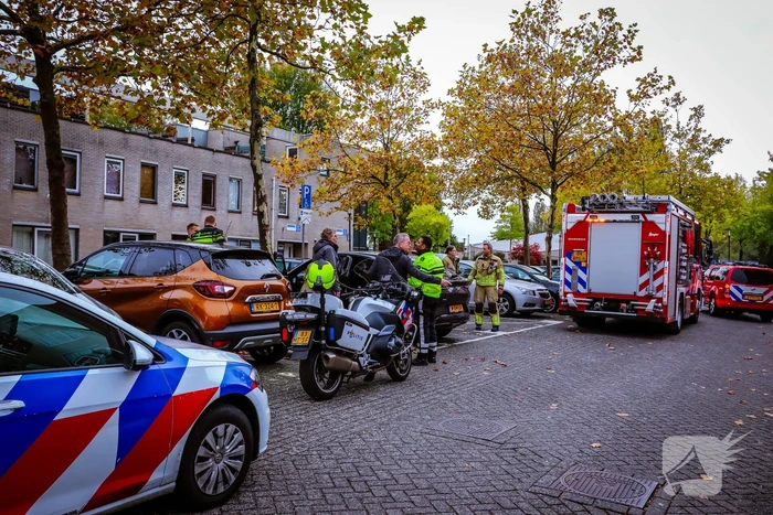 Persoon bekneld in auto
