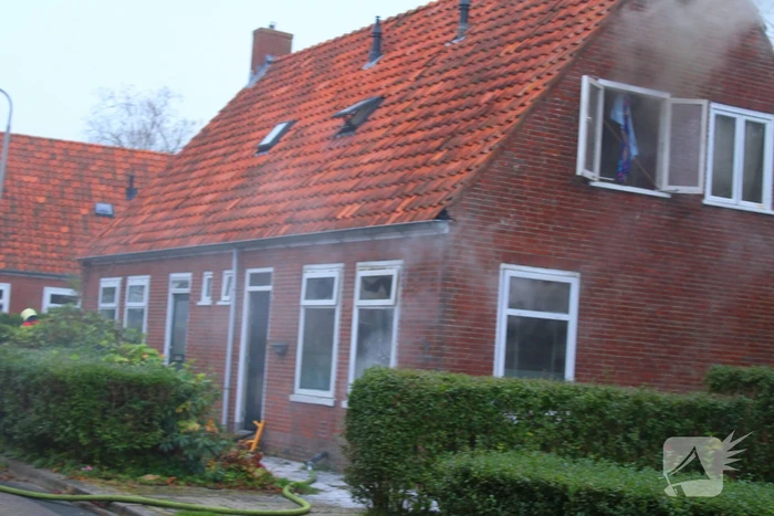 Flinke rookontwikkeling bij middelbrand in woning