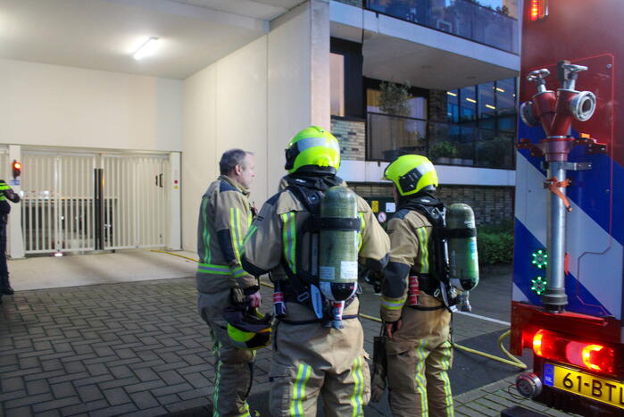 Rookontwikkeling in garage van flat