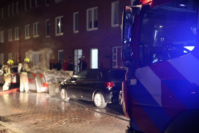 Brand in container met bouwafval