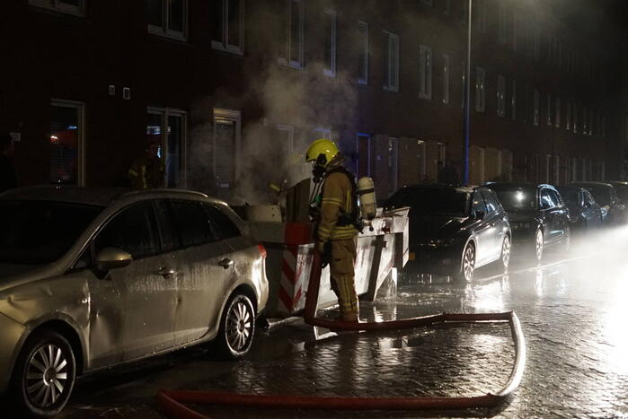 Brand in container met bouwafval