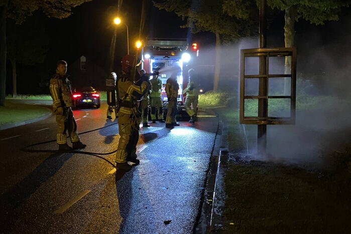 Reclamebord in brand gestoken