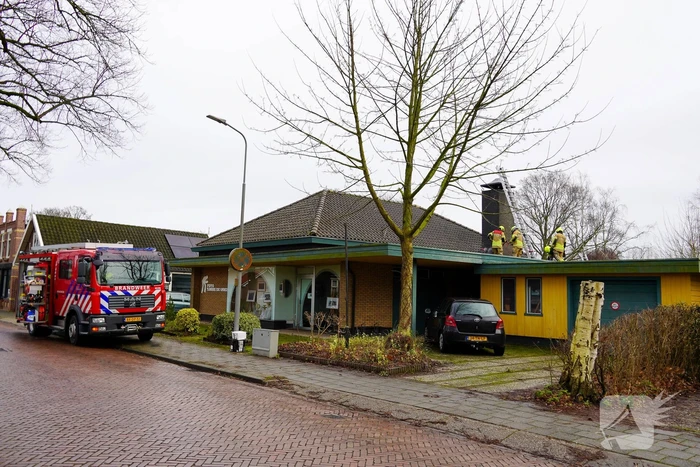 Brand in schoorsteen van fotowinkel