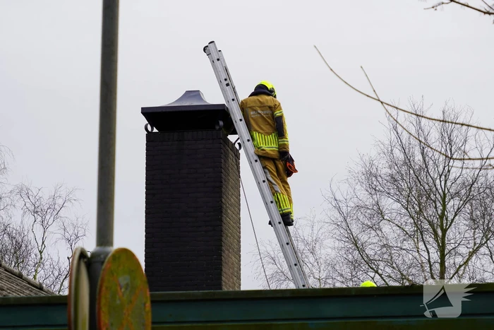 Brand in schoorsteen van fotowinkel