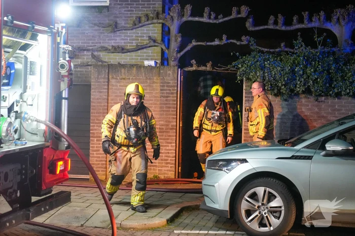Brand in garage van woning