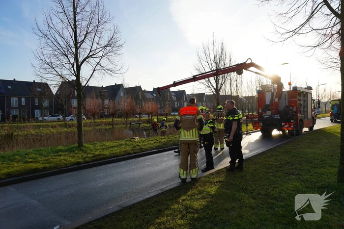 Auto te water na aanrijding