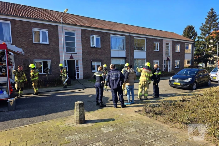 Melding van brand in portiekwoning