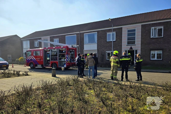 Melding van brand in portiekwoning