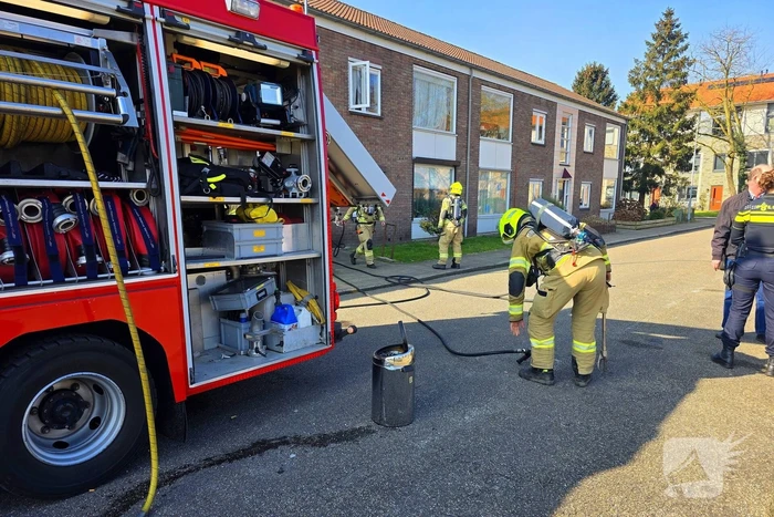 Melding van brand in portiekwoning