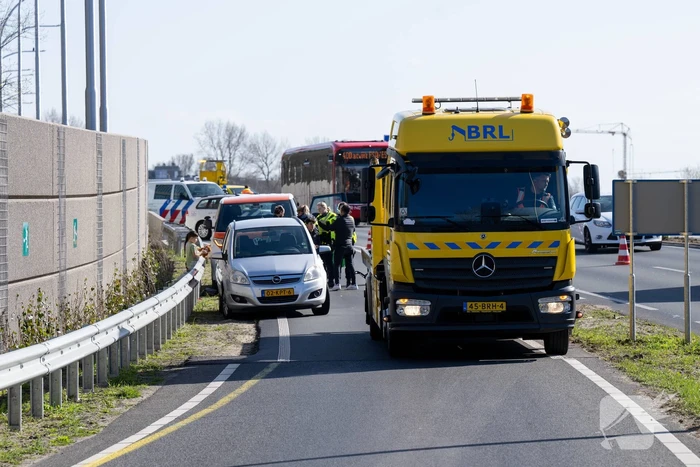 Schade en vertraging na kop-staartbotsing