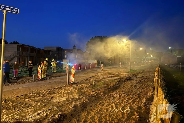 Brand in en naast ondergrondse container