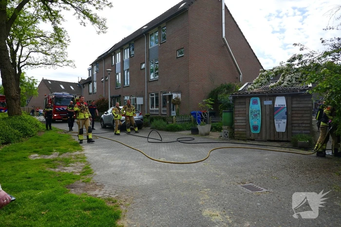 Schade aan poort en schutting door brand