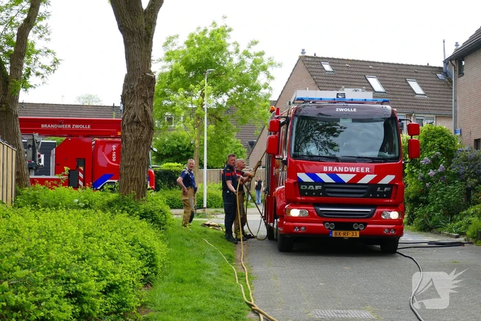 Schade aan poort en schutting door brand