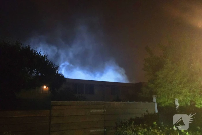 Gezin uit brandende woning gered via ladder