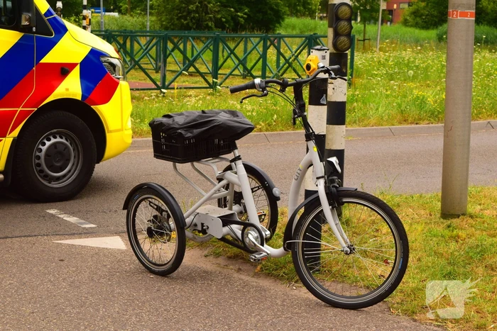 Botsing driewielfiets en auto