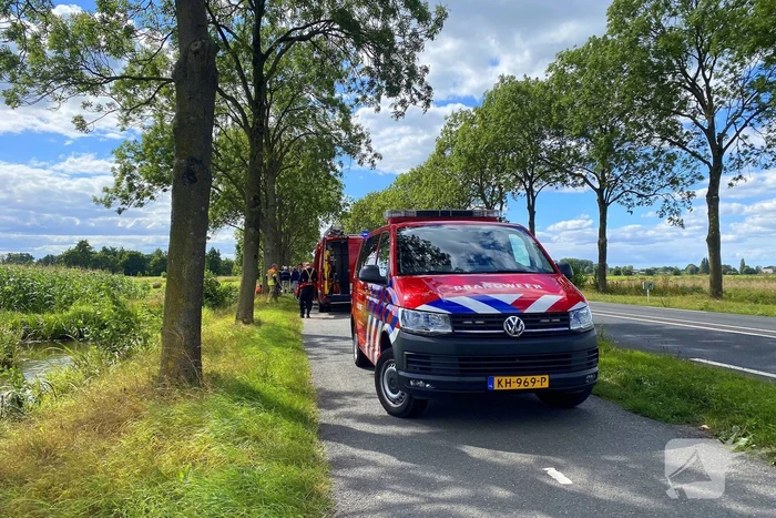 Driewielerbestuurder raakt te water