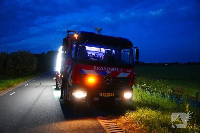 Reddingsactie door brandweer en boer
