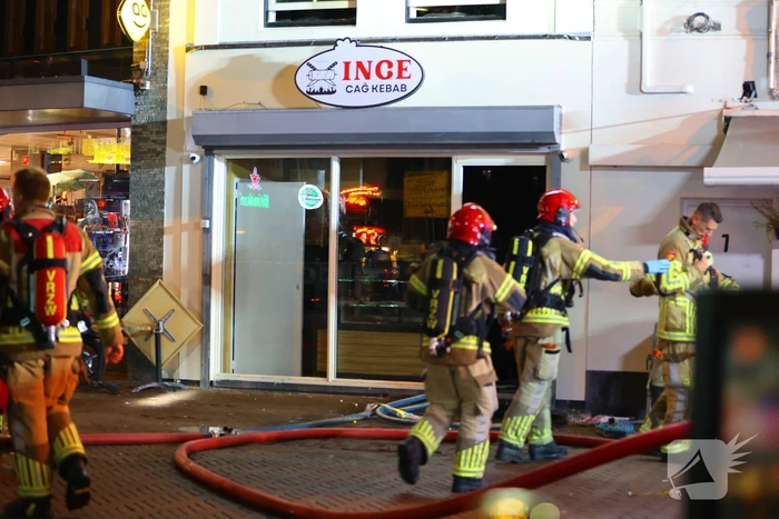 Grote brand boven winkels