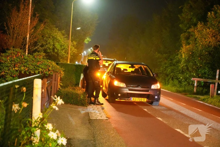 Verkeersongeval tussen auto en scooter na inhaalactie