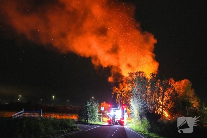 Woningbrand met veel bomen