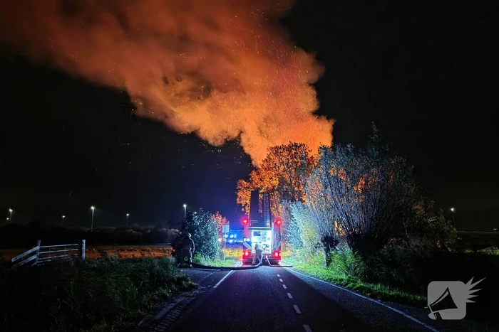 Woningbrand met veel bomen