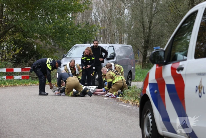 Man met scootmobiel te water