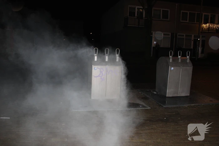 Ondergrondse papiercontainer vat vlam