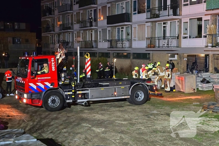 Kind bekneld onder pallet stenen