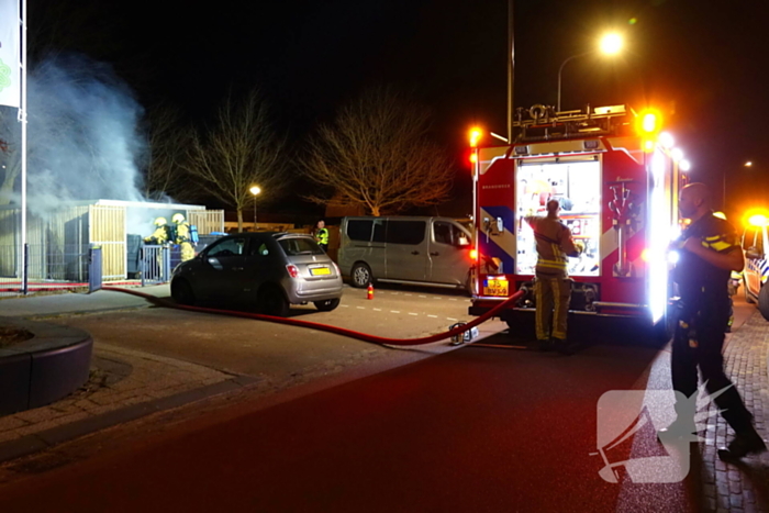 Brand in containers in fietsenstalling school