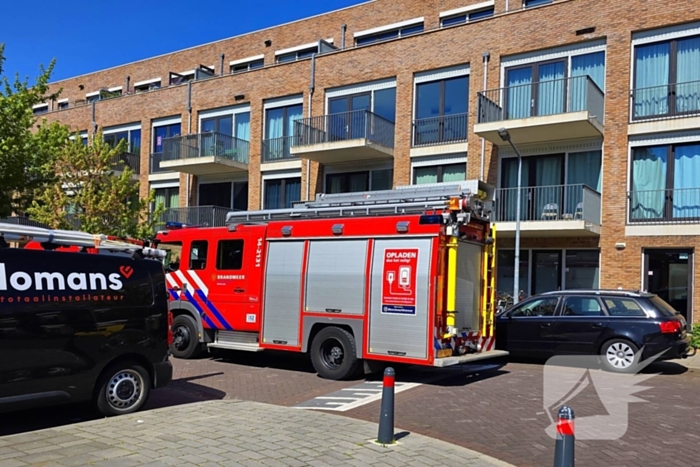 Palletkachel veroorzaakt brandmelding in flatwoning
