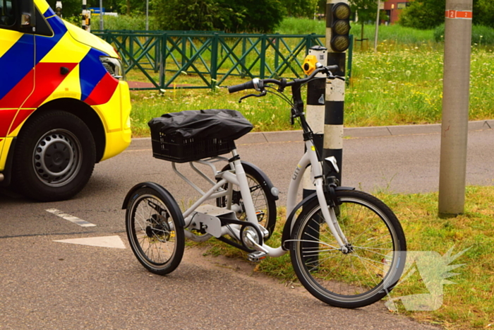 Botsing driewielfiets en auto