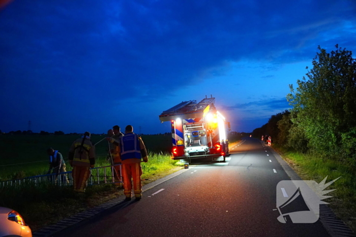 Reddingsactie door brandweer en boer