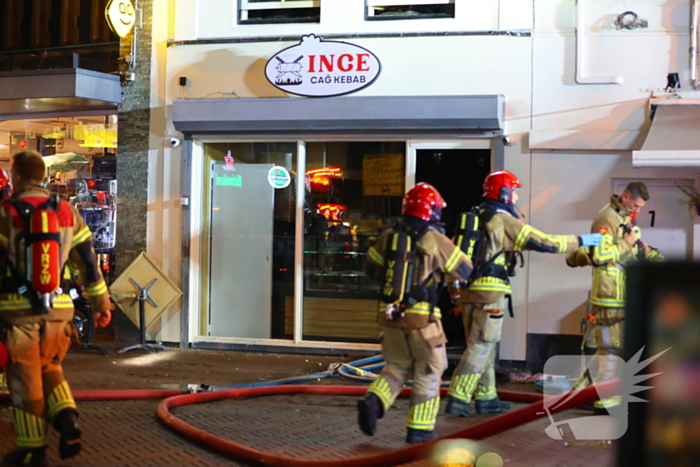 Grote brand boven winkels