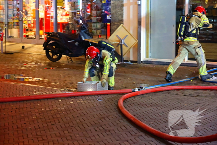 Grote brand boven winkels