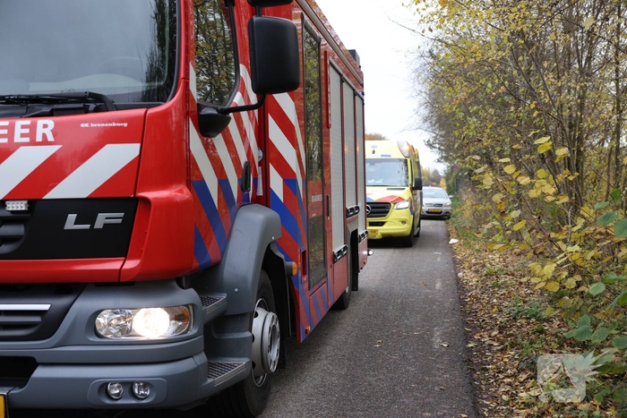 Man met scootmobiel te water
