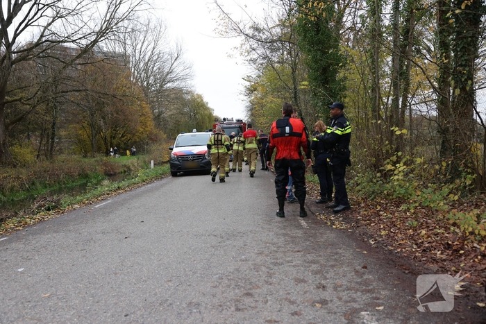 Man met scootmobiel te water