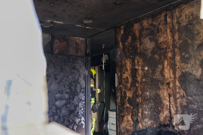 Politie pakt bewoner na woningbrand