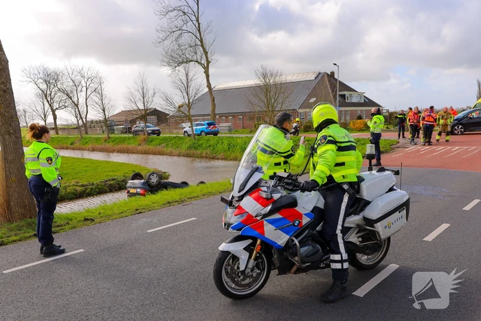Auto te water na aanrijding