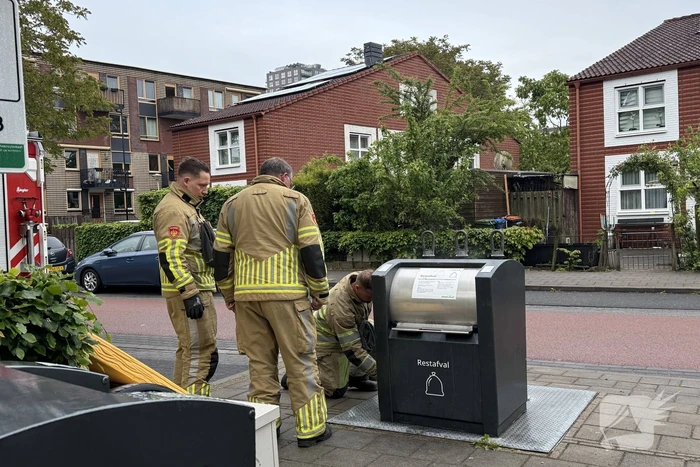 Ondergrondse container in brand