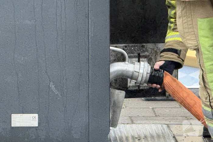 Ondergrondse container in brand