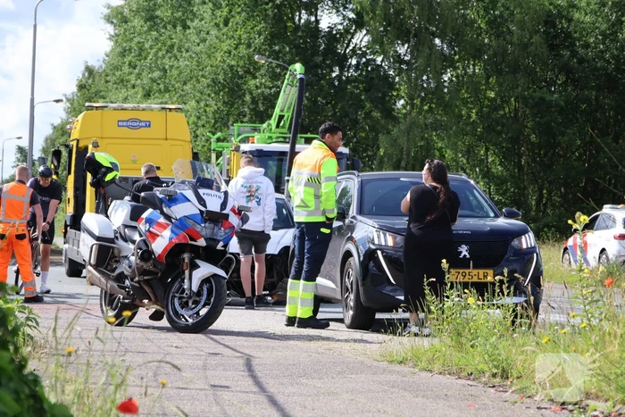 Botsing tussen auto en brommobiel